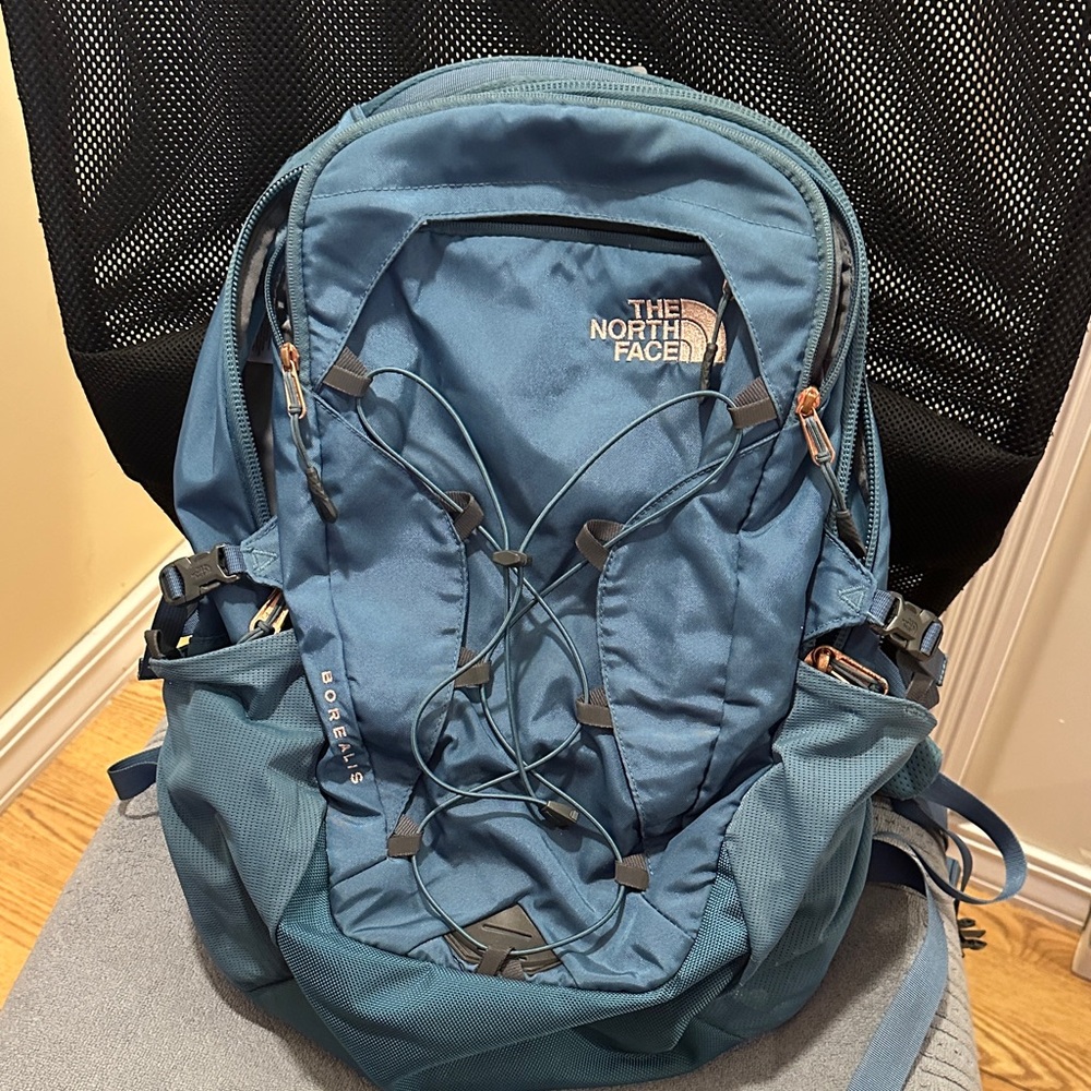 The North Face teal Borealis backpack with rose gold accents